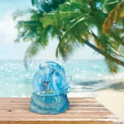 Enesco Disney Lilo & Stitch - Boule à neige Stitch Surfeur